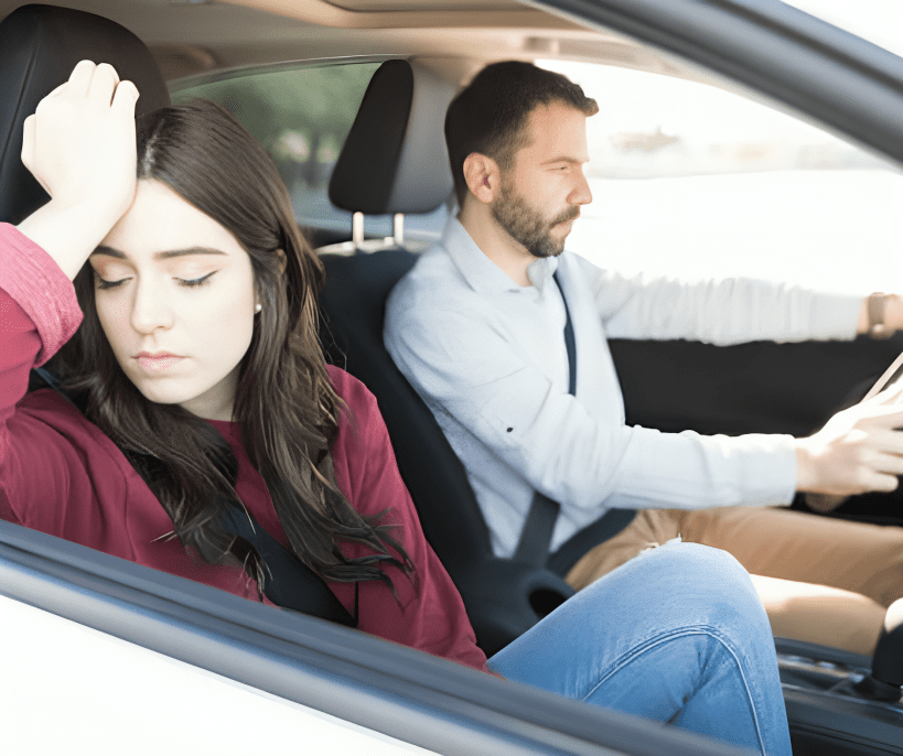 couple in a car the woman disappointed while man is driving