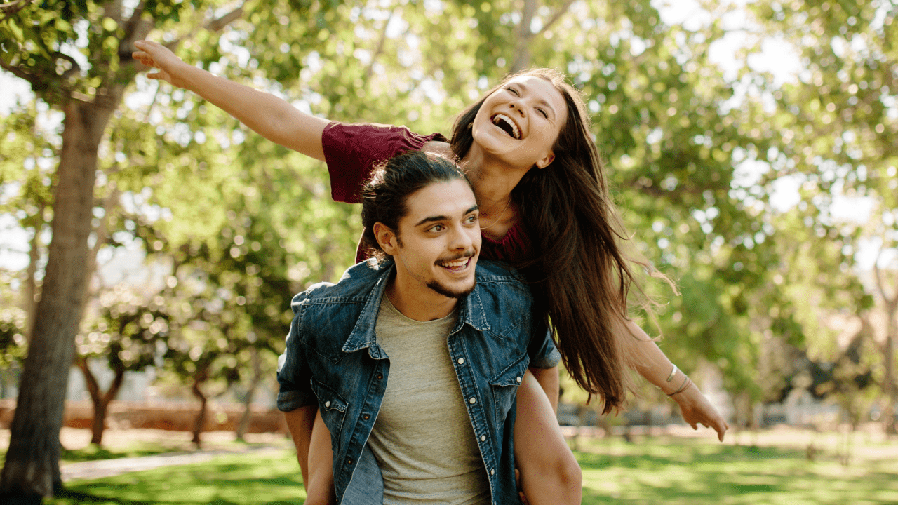 Happy young couple walking together outdoors