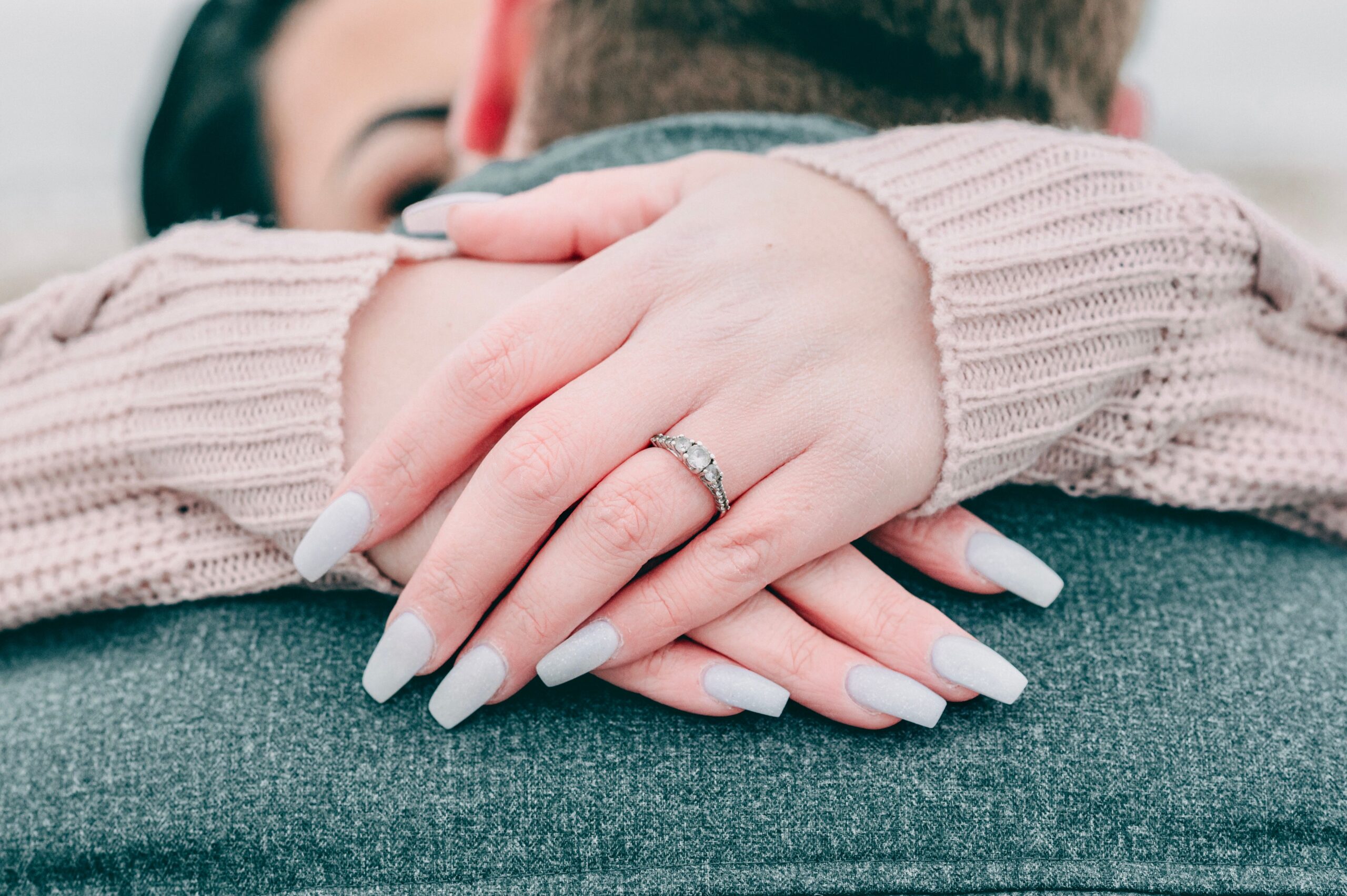 Ring on a hand of the woman embracing a man Ring on a hand of the woman embracing a man