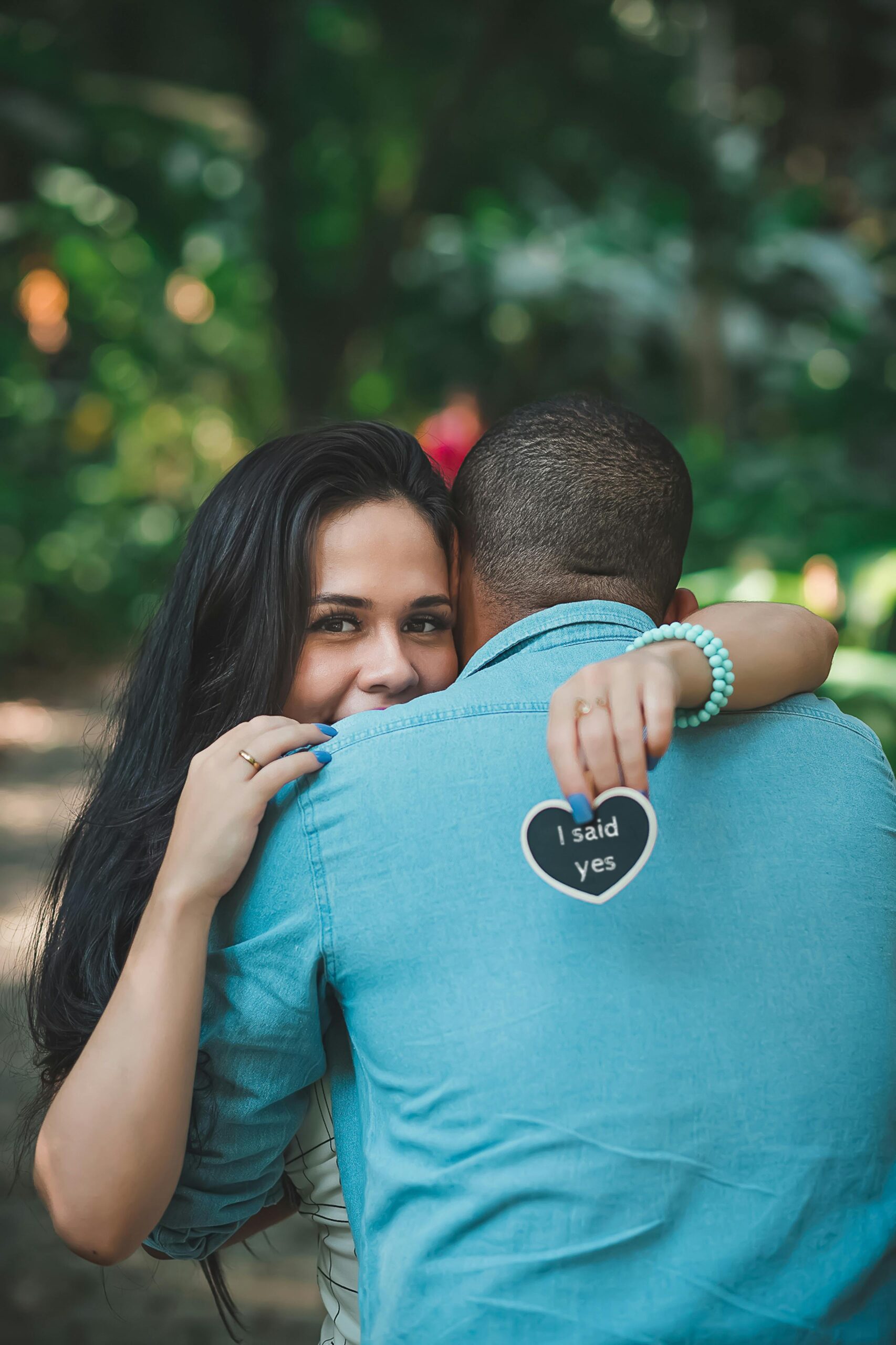 Woman hugging man after engagement