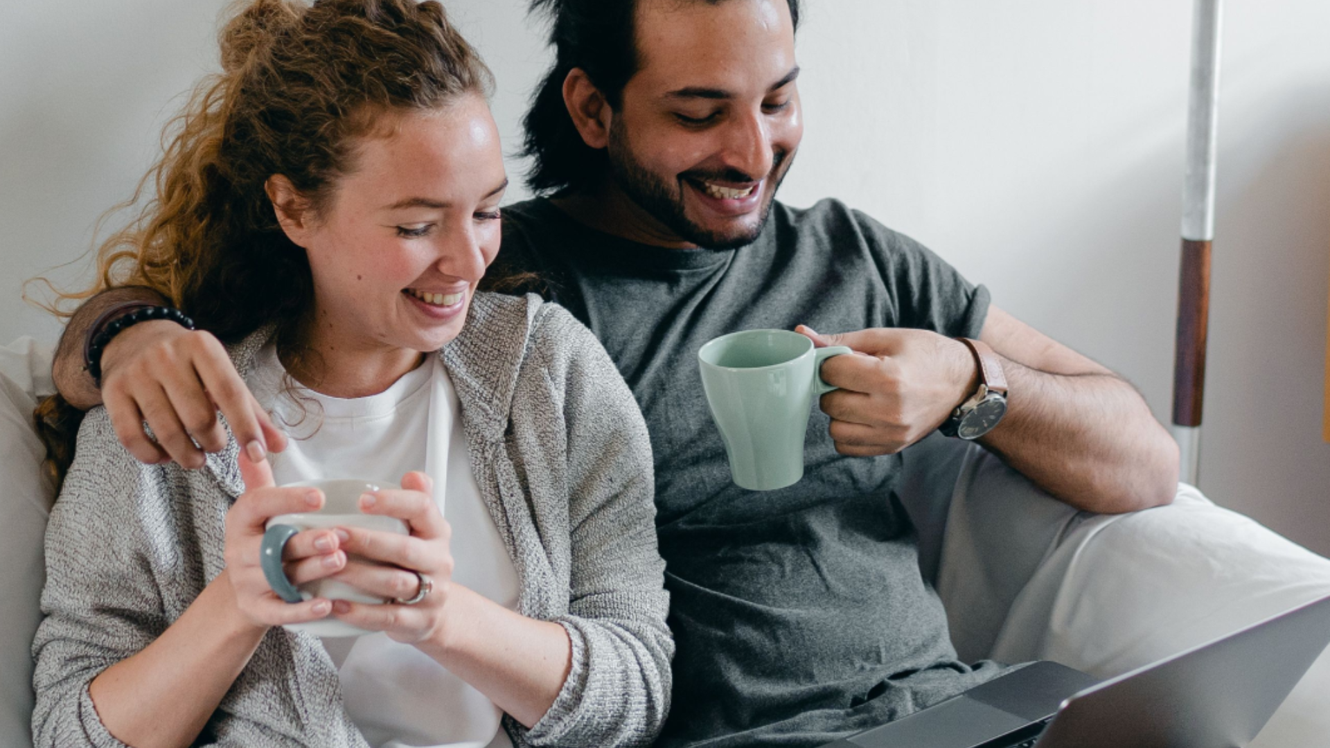 Couple beginning online therapy together through secure video sessions at home