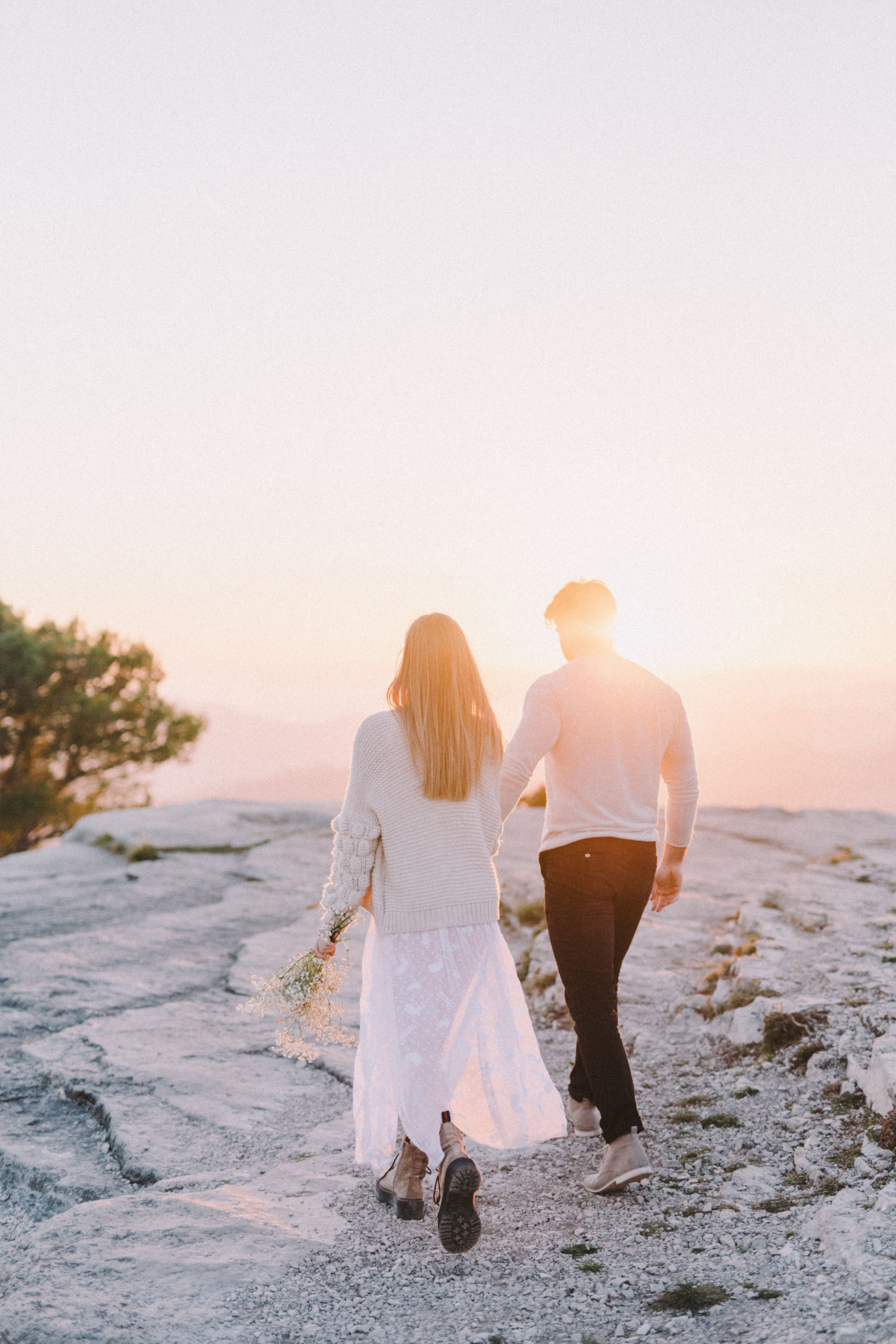 Couple walking together outdoors, reflecting on marriage and relationship decisions through couples counseling