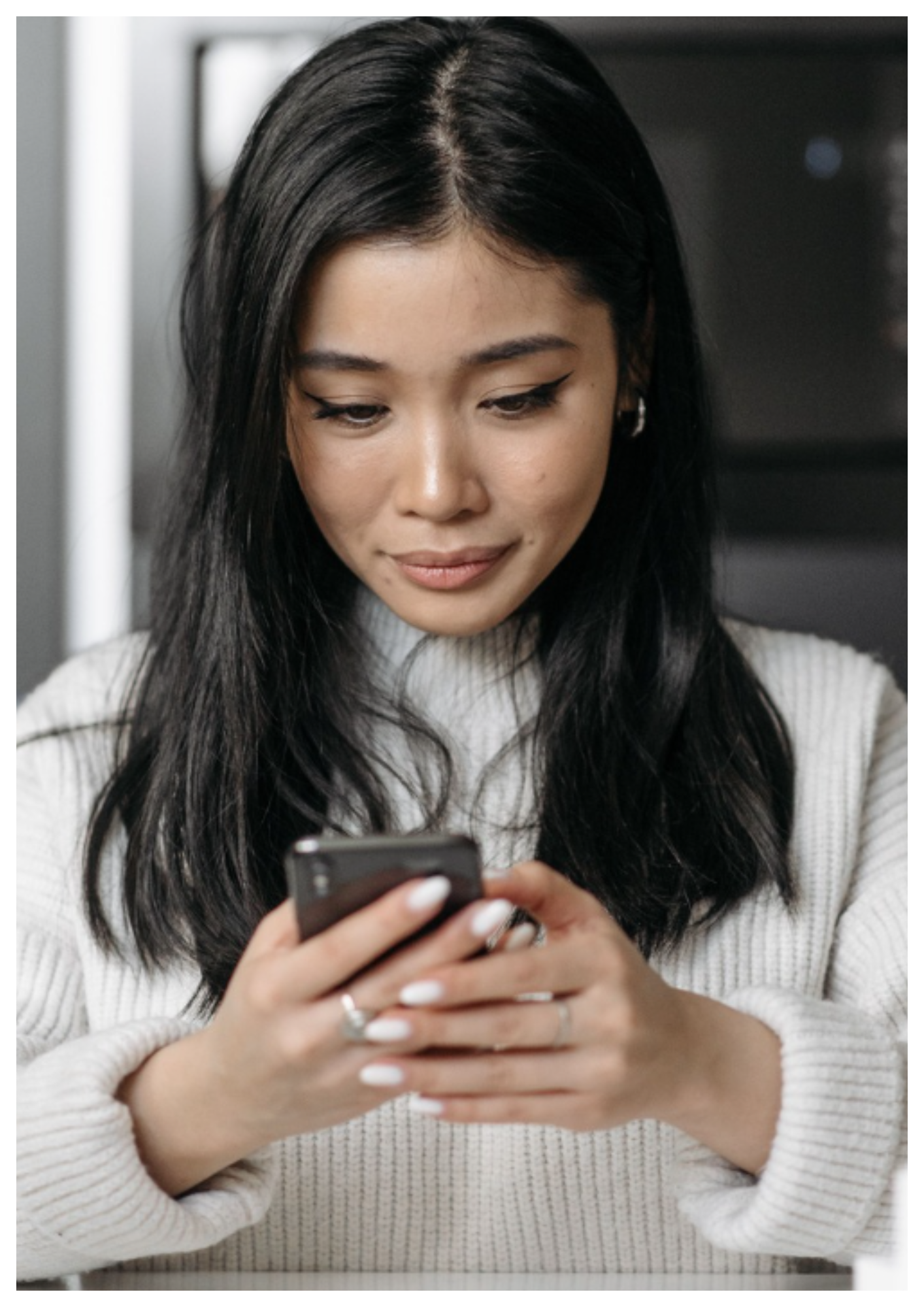 Woman using smartphone for online therapy and insurance information