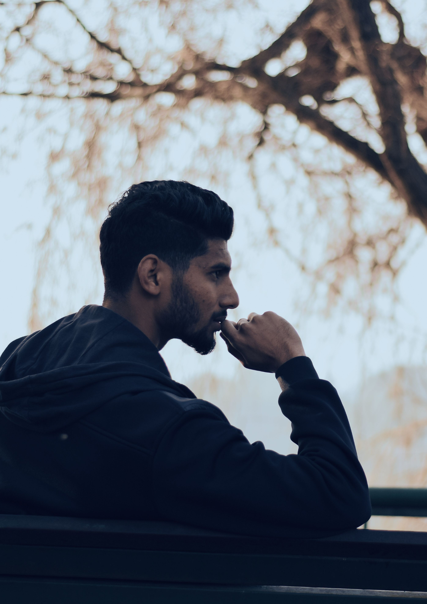 Man reflecting outdoors while experiencing anxiety