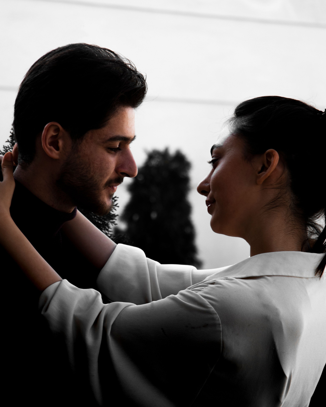 Couple embracing and sharing an intimate moment, reflecting emotional connection in a relationship