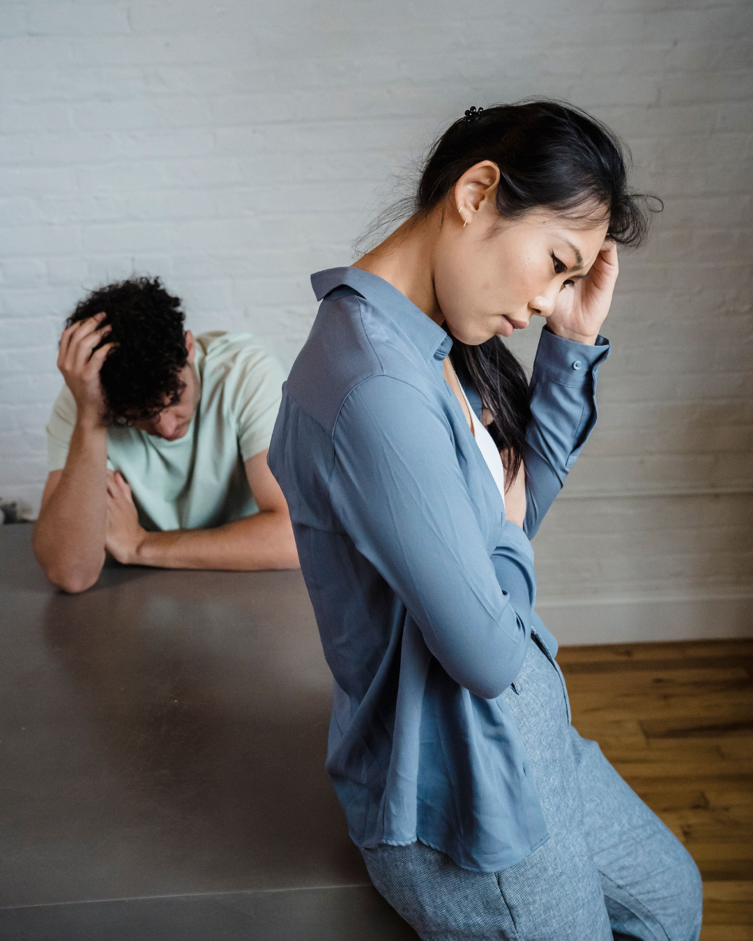 Couple experiencing emotional distress and defensiveness during relationship conflict